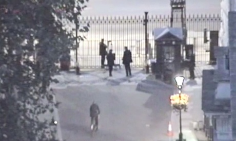 CCTV from Downing Street shows Andrew Mitchell cycling toward the exit gate before his confrontation with officers.
