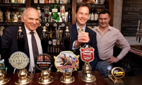 Anything Nigel Farage can do... Nick Clegg and Vince Cable show they are in touch with the people as they pull a pint of London Pride at the Queens Head Pub in Soho, London.