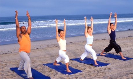 four people doing yoga