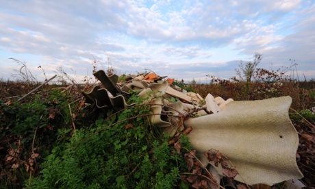 Plastic and asbestos are left strewn on the sides of an agriculture field near Orta di Atella, southern Italy, on November 14, 2013. Orta di Atella is one of the villages inside the 