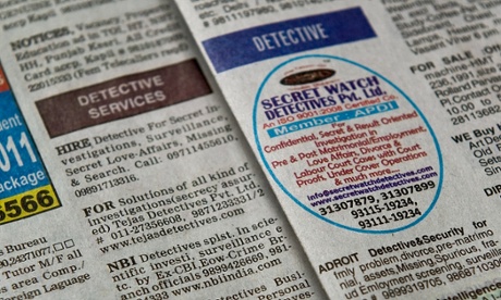Detectives for hire in a Delhi newspaper's small ads column.  Delhi.  Photograph: Manan Vatsyayana/AFP/Getty Images