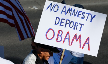 Anti-Obama protesters gather across the street from Del Sol High School where President Obama is scheduled to deliver remarks on his use of executive authority to relax U.S. immigration policy in Vegas, Nevada November 21, 2014 .