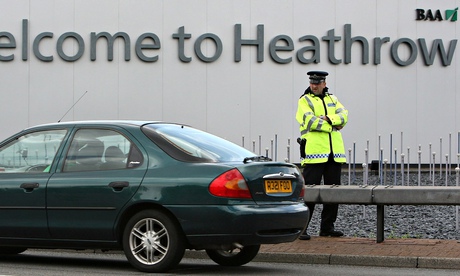 Police officer near entrance to Heathrow airport