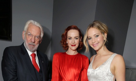 Donald Sutherland with Jena Malone and Jennifer Lawrence.