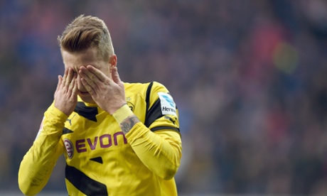 Dortmund's Marco Reus celebrates his goal but Paderborn fought back to draw 2-2.
