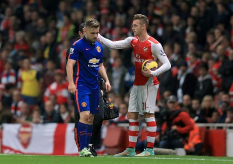 Calum Chambers consoles Luke Shaw as he is substituted after an injury.
