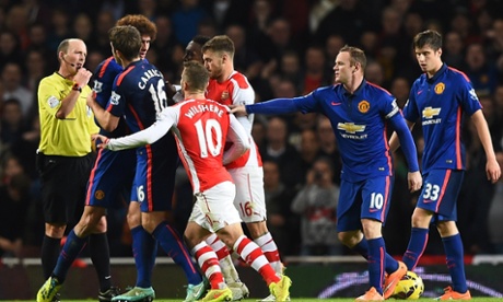 Michael Carrick tries to break-up a confrontation between Wilshere and Fellaini. Wilshere is lucky not to see red as he stuck his head into Fellaini.