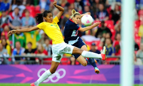 LONDON, ENGLAND - JULY 31:  Kelly Smith #10 of Great Britain shoots at goal uinder pressure from Bruna #14 of Brazil during the Women's Football first round Group E Match between Great Britain and Brazil on Day 4 of the London 2012 Olympic Games at Wembley Stadium on July 31, 2012 in London, England.  (Photo by Mike Hewitt/Getty Images)Football|topics|topix|bestof|toppics|toppix|topics|topix|bestof|