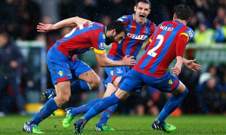 Mile Jedinak of Crystal Palace celebrates scoring his team's third goal against Liverpool in the Premier League.