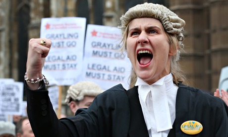 A barrister at a protest over cuts to legal aid, which has lost £350m a year – 83% of lawyers now be