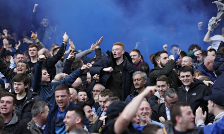 Everton fans celebrate a goal against Arsenal