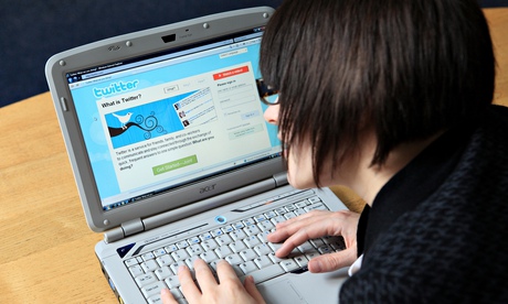 A woman using the twitter website