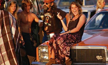 Fans of the rock group Grateful Dead hang out in a parking lot before a concert in 1987