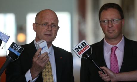 Senator David Leyonhjelm with head of corporate affairs for Imperial tobacco Andrew Gregson, holding illegal tobacco products.