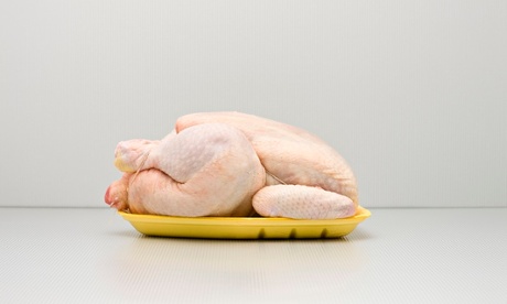 Raw whole chicken on polystyrene tray