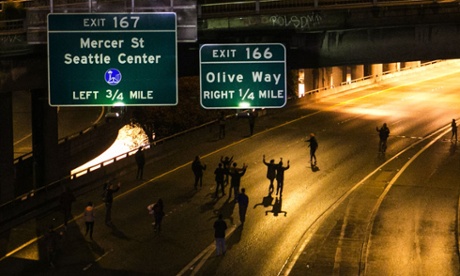 Protesters make their way down Interstate 5 northbound from downtown Seattle, Monday Nov. 24, 2014.