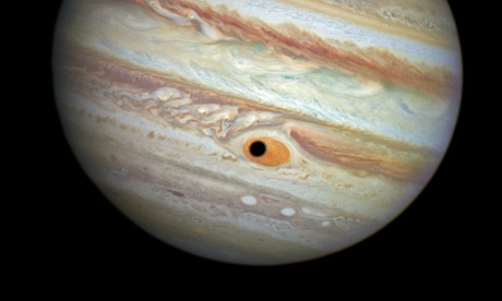 This happened on April 21, 2014, when Hubble was being used to monitor changes in Jupiter's immense Great Red Spot (GRS) storm. During the exposures, the shadow of the Jovian moon Ganymede swept across the center of the GRS. This gave the giant planet the uncanny appearance of having a pupil in the center of a 10,000-mile-diameter 