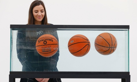 Jeff Koons, Three Ball Total Equilibrium Tank, 1986. Three basketballs suspended in tank