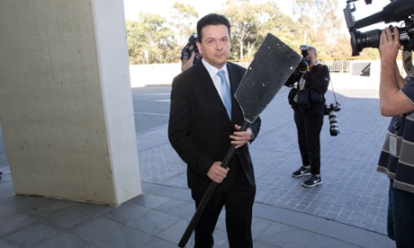 Independent South Australian Senator Nick Xenophon awaits his turn in front of the cameras complete with his 