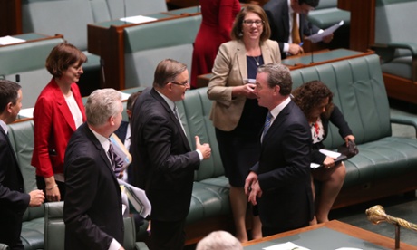 Shadow for Infrastructure Anthony Albanese and the Leader of the House Christopher Pyne exchange pleasantries.
