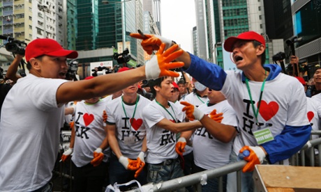 Hong Kong protest - people in red baseball caps argue with demonstrators