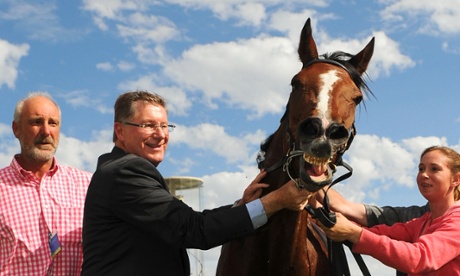BALLARAT, AUSTRALIA - NOVEMBER 22:  Premier of Victoria Denis Napthine  poses with Mujadale before he reared up after winning Race 8, the Sportsbet.com.au Ballarat Cup during the Ballarat Cup Day on November 22, 2014 in Ballarat, Australia.  (Photo by Vince Caligiuri/Getty Images)Horse Racing