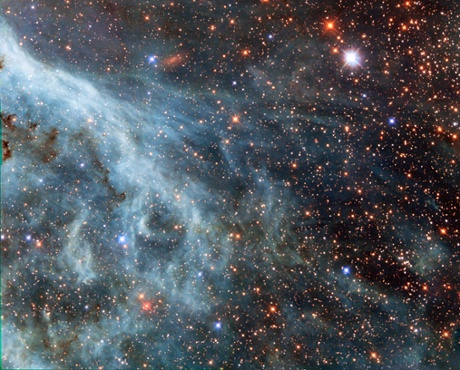 This image actually shows part of the Large Magellanic Cloud (LMC), a small nearby galaxy that orbits our galaxy, the Milky Way, and appears as a blurred blob in our skies.