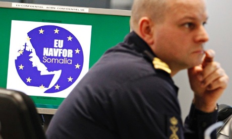 A member of staff works at the EU naval force operations headquarters in London.