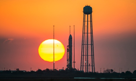 The Orbital Sciences Corporation Antares rocket, with the Cygnus spacecraft onboard, is seen on launch Pad-0A during sunrise, Sunday, Oct. 26, 2014, at NASA's Wallops Flight Facility in Virginia.