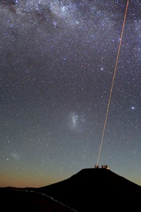 A solitary laser beam cuts through the night sky. It streaks upwards from Unit Telescope 4 of ESO's Very Large Telescope, located at Paranal Observatory in Chile.