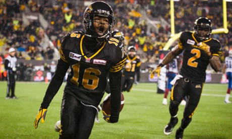 Hamilton Tiger-Cats Brandon Banks celebrates his touchdown against the Montreal Alouettes during the second half of their CFL Eastern Final.