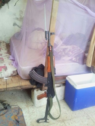 A gun at foot of bed – one of the pictures found with the Nawaz brothers,