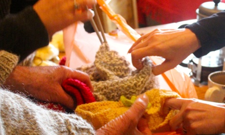 hands with knitting needles and wool