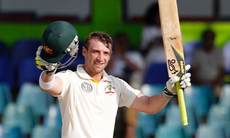 Phillip Hughes celebrates after scoring a century against Sri Lanka in Colombo.