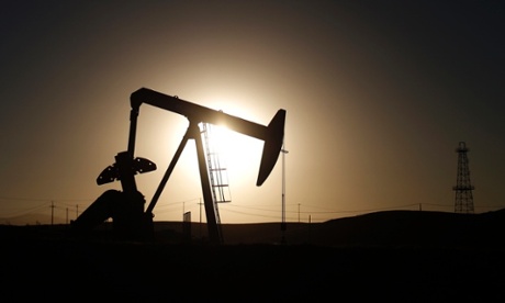 A pump jack is seen at sunrise near Bakersfield, California October 14, 2014. Brent crude hit a new four-year low on Wednesday before recovering to just under $85 a barrel.