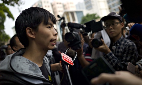 Student leader Joshua Wong (L) speaks wi