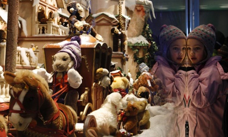 child reflected in decorated shop window