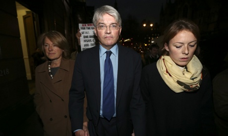 Andrew Mitchell, his wife Dr Sharon Bennett (L) and a woman believed to be his daughter (R) leave the High Court.