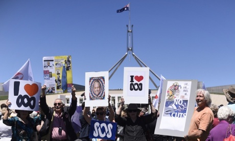 Protesters rally to oppose cuts to the ABC outside Parliament House in Canberra on Tuesday.