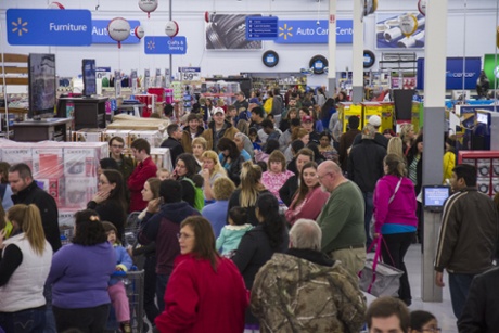 Customers shop hundreds of deals during Walmart's first Black Friday event at 6 p.m. Thanksgiving night, Thursday, Nov. 27, 2014 in Bentonville, Ark.