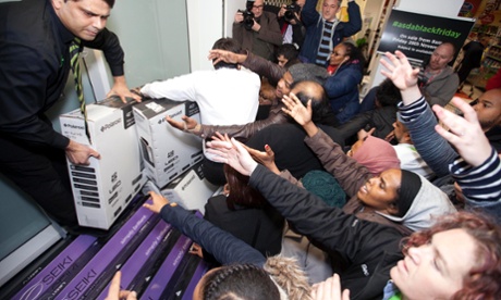 Shoppers at the Asda store in Wembley, north west London take advantage of the store's Black Friday offers