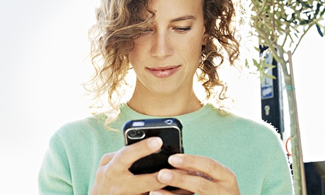 Woman using mobile phone outside