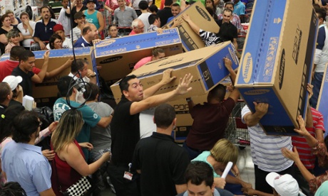 Shoppers at Sao Paulo, Brazil  chase Black Friday bargains.