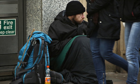 Man begging outside a bank