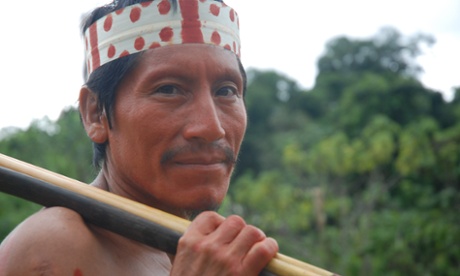 Matsés man Alesandro Dunu Mayoruna, from Sao Meireles village in Brazil, painted with achiote to receive visitors and talk about oil company Pacific Rubiales.