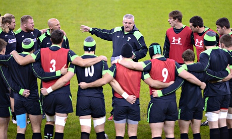Warren Gatland talks to Wales squad members during training