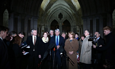Andrew Mitchell with his family outside court after losing his libel case against the Sun