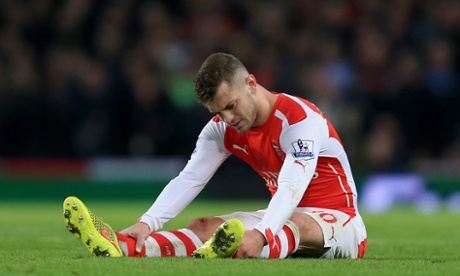 File photo dated 22-11-2014 of Arsenal's Jack Wilshere sits injured on on the pitch. PRESS ASSOCIATION Photo. Issue date: Thursday November 27, 2014. Midfielder Jack Wilshere will be out for approximately three months after undergoing successful surgery on his left ankle, Arsenal have announced. See PA story SOCCER Arsenal. Photo credit should read Mike Egerton/PA Wire.Full length football