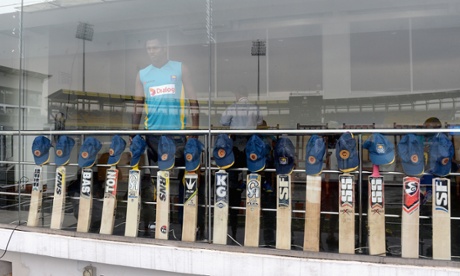 Sri Lanka captain Angelo Mathews look on as his team put their bats out in memory of the Australian cricketer Phillip Hughes ahead of the second One Day International against England.