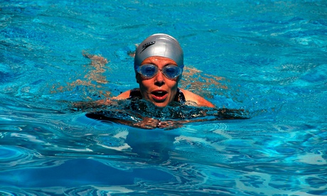 A woman swims in an  outdoor hotel swimming pool. Image shot 2008. Exact date unknown.